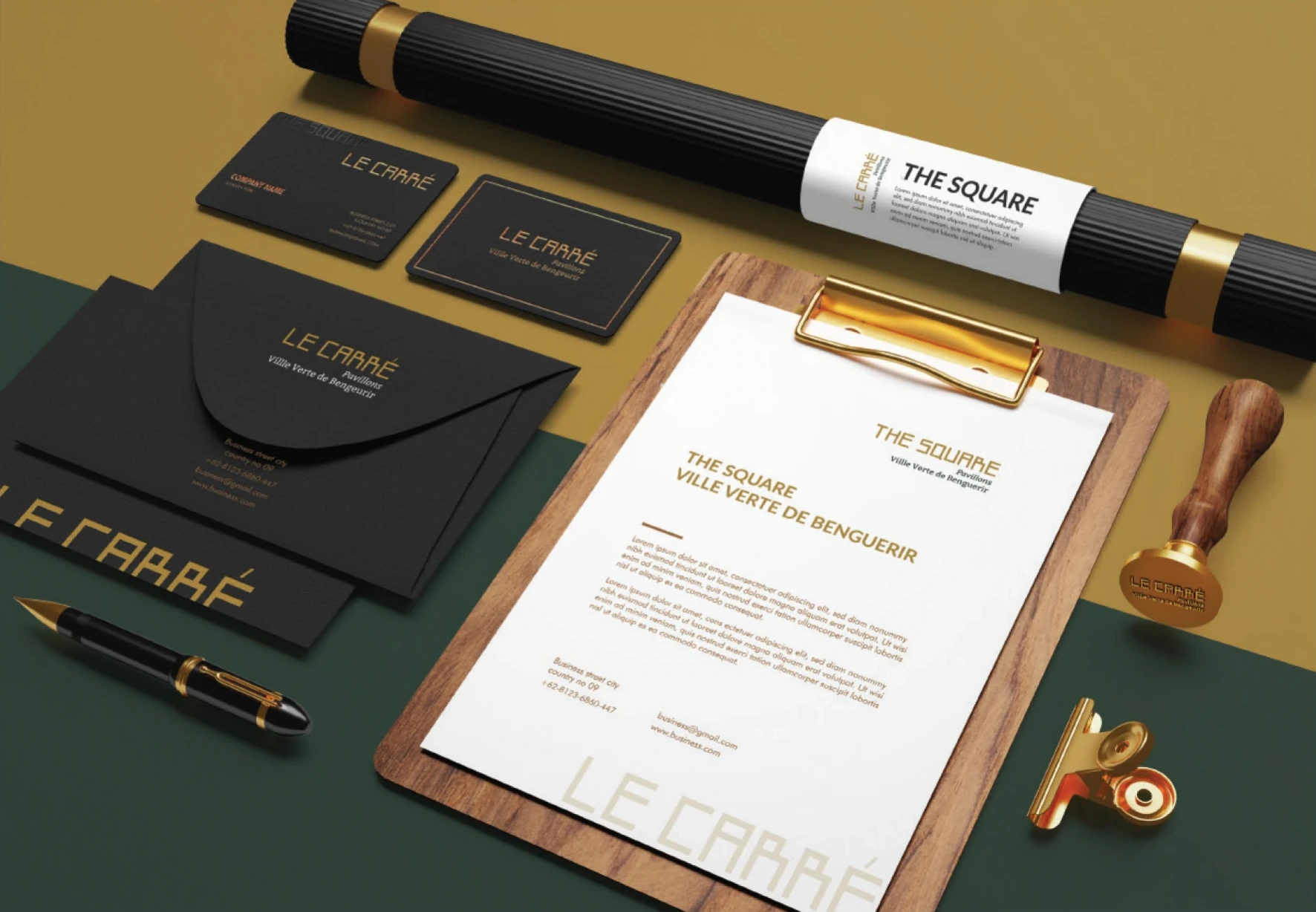 The Square branded stationery on a dark green surface.